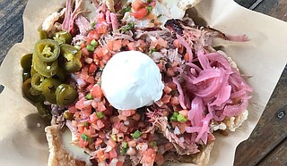 The Pig & Pint made Food Network's list for its pork rind nachos, which are made with pulled pork, smoked chicken or brisket on rinds topped with queso, smokehouse beans, pickled onions, pico de gallo, jalapenos, sour cream and the restaurant's Mississippi sweet barbecue sauce. Photo courtesy The Pig & Pint