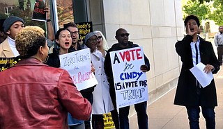 Approximately 30 protesters gathered on the sidewalk on Nov. 16, 2018, outside U.S. Sen. Cindy Hyde-Smith’s office, calling for her resignation. Co-organizer Genesis Be, a Gulf Coast native, is pictured to the right. Photo by Ko Bragg