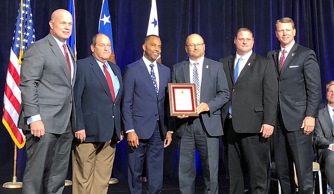 Acting U.S. Attorney General Matthew Whitaker honored Mississippi's Project EJECT at the Project Safe Neighborhoods Conference in Kansas City, Mo., on Dec. 6, 2018. Left to right are: Whitaker, Hinds County Assistant District Attorney Pat McNamara, Jackson Police Department Assistant Chief Ricky Robinson, First Assistant U.S. Attorney Darren LaMarca, U.S. Attorney's Office Criminal Chief Courtney Coker and U.S. Attorney Mike Hurst. Photo courtesy U.S. Attorney Mike Hurst's Office