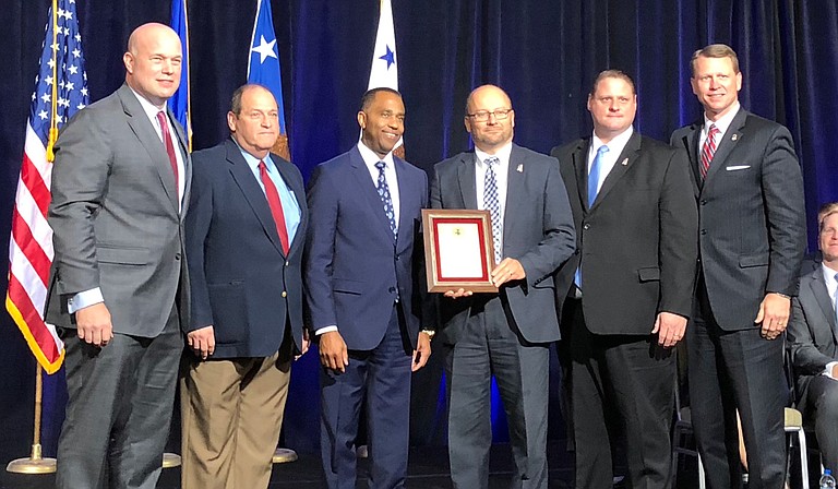 Acting U.S. Attorney General Matthew Whitaker honored Mississippi's Project EJECT at the Project Safe Neighborhoods Conference in Kansas City, Mo., on Dec. 6, 2018. Left to right are: Whitaker, Hinds County Assistant District Attorney Pat McNamara, Jackson Police Department Assistant Chief Ricky Robinson, First Assistant U.S. Attorney Darren LaMarca, U.S. Attorney's Office Criminal Chief Courtney Coker and U.S. Attorney Mike Hurst. Photo courtesy U.S. Attorney Mike Hurst's Office