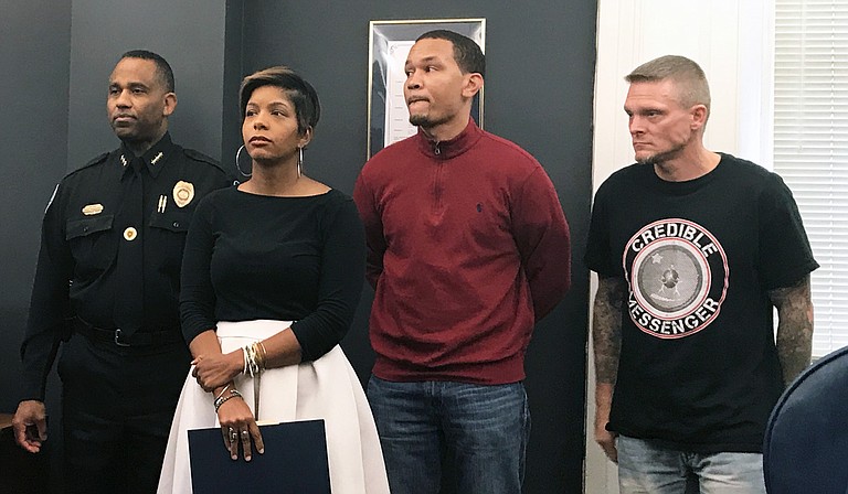 JPD Assistant Chief Ricky Robinson, criminal-justice advocate Rukia Lumumba, and reformed criminals Terun Moore and Benny Ivey wait in City Hall to explain Jackson's new credible-messenger strategy.