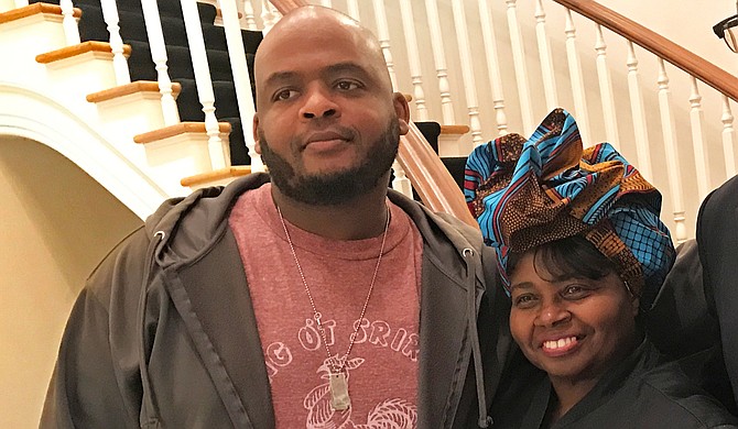 Author Kiese Laymon (left), whose memoir "Heavy" was one of last year's most acclaimed works, has won the Andrew Carnegie Medal for Excellence. He is pictured here with his aunt, Carolyn Coleman (right).