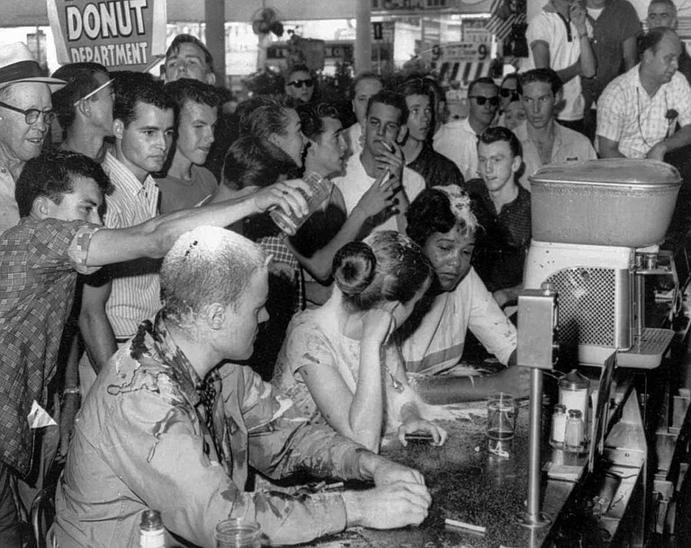 In 1963, Anne Moody participated in the famous sit-in at Woolworth lunch counter in Jackson, together with fellow Tougaloo student Joan Trumpauer and Tougaloo professor John Salter Jr. A white mob attacked Moody and her companions and poured flour, sugar, ketchup and mustard on them. Photo courtesy AP/Fred Blackwell/Jackson Daily News