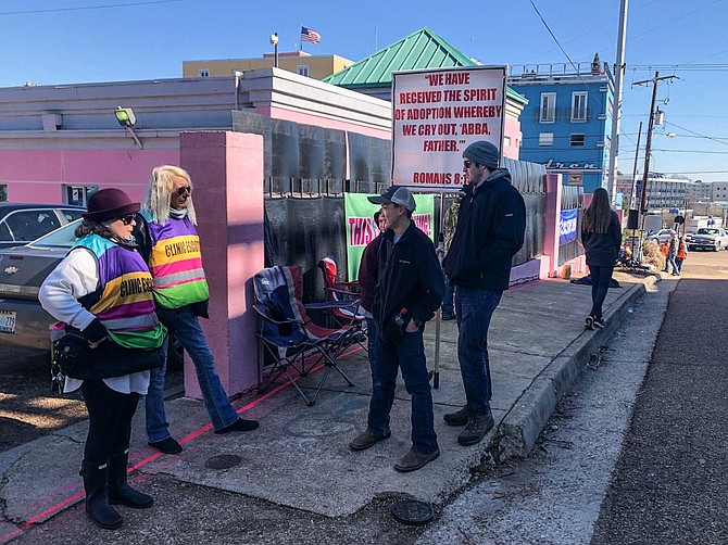 Clinic escorts, who help patients at the Jackson Women’s Health Organization avoid anti-abortion protesters, engage with child protesters on the sidewalk in Fondren on Jan. 24, 2019.