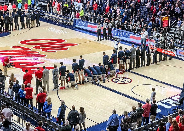 Eight Mississippi players kneeled during the national anthem in response to a Confederacy rally near the arena before the Rebels' 72-71 victory over Georgia on Saturday. Photo courtesy Nathanael Gabler/The Oxford Eagle via AP
