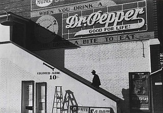 An African American man enters the "colored" entrance of a segregated movie theater in Belzoni in Humphreys County, Miss., in 1939. Photo by Marion Post Wolcott