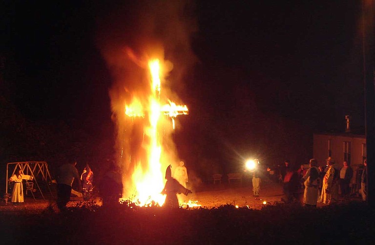 Cross burnings, like this one at an unidentified location in 2005, are less common than they were in the Jim Crow era, but remain staples of private Klu Klux Klan gatherings. People still sometimes use them to intimidate and harass African Americans. Photo courtesy Wikimedia Commons