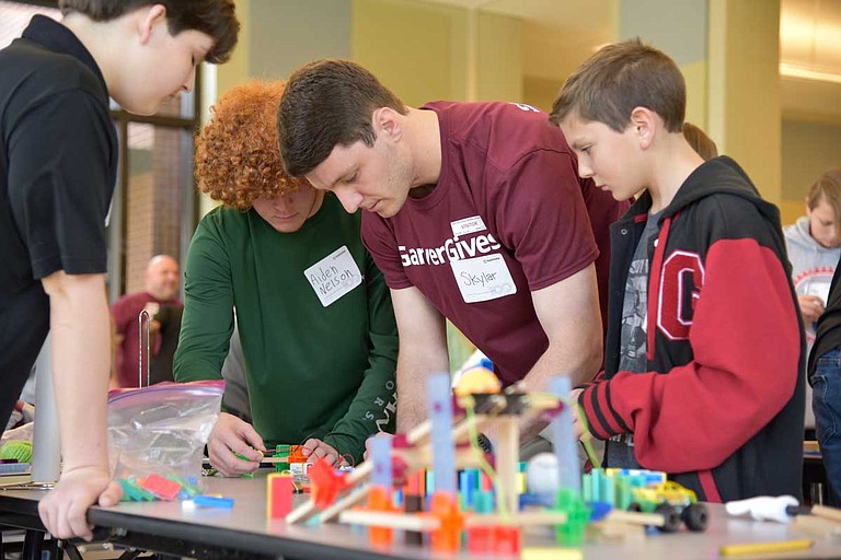 Garver sent a group of engineers to Germantown Middle School to observe the students' devices for the Garver Chain Reaction Challenge and teach them about STEM subjects, or science, technology, engineering and math. Photo courtesy Garver