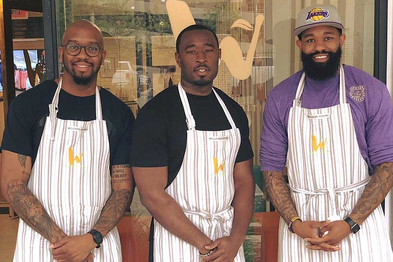 Left to right: Waisted Nutrition owner Johnny Markham with employees Shrod Williams and Karl Calendar Photo courtesy Waisted Nutrition/Facebook