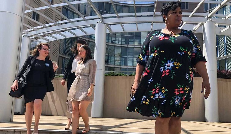 Jackson Women's Health Organization Director Shannon Brewer (right, front) leaves federal court in Jackson, joined by attorneys from the Center for Reproductive Rights, after a hearing on Mississippi's six-week abortion ban.
