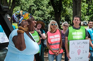 Mississippi in Action Executive Director Valencia Robinson told a crowd of abortion rights supporters outside the Mississippi Capitol building on May 21 that she is "pissed off" over efforts to restrict women's rights in states all across the country.