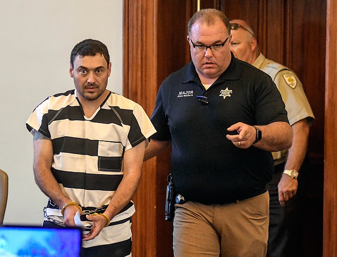 Lafayette County Sheriff Dept. Maj. Alan Wilburn (right) escorts Oxford Police Officer Matthew Kinne (left) into a hearing at the Lafayette County Courthouse, Wednesday, May 22, 2019, in Oxford, Miss. Kinne is charged in the death of 32-year-old Dominique Clayton, who was found dead Sunday. Photo by Bruce Newman/The Oxford Eagle via AP