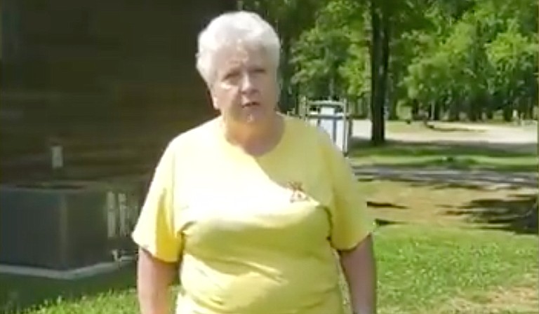 A video posted Sunday to a Facebook page apparently belonging to Macon, Mississippi, resident Jessica Richardson shows a woman in a KOA shirt holding a gun as Richardson and her husband tell her they didn't know they needed a reservation. Photo courtesy Jessica Richardson