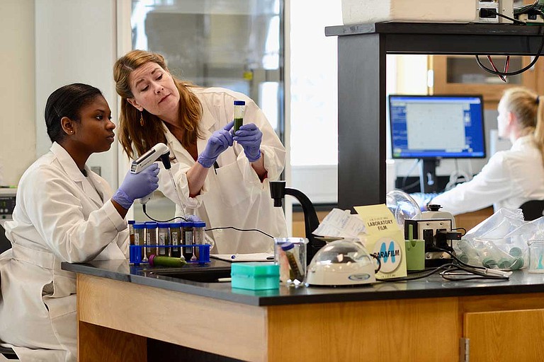 Belhaven University recently announced that Elizabeth Brandon (center), an associate professor of biology at Belhaven, and a team of student researchers have made discoveries in their research in using kale to help combat cancer. Photo courtesy Belhaven University