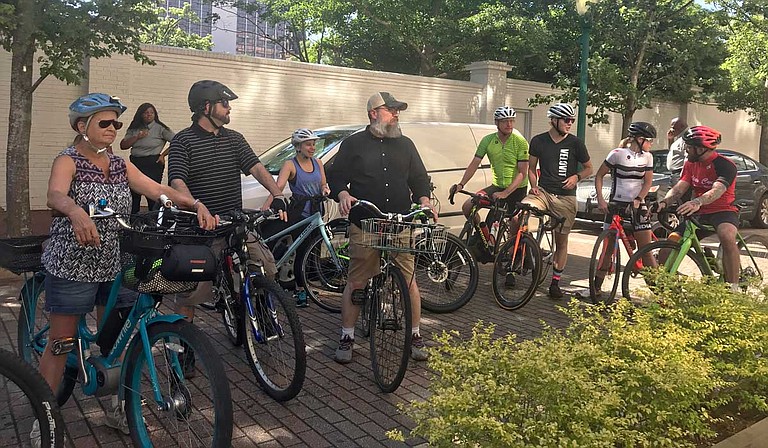 Jackson residents wait for Mayor Chokwe A. Lumumba to kick off the first "Slow Roll," a bike ride with the mayor through downtown, outside the Congress Street parklet on May 23.