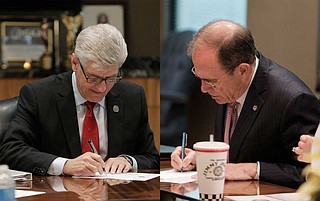 Gov. Phil Bryant (left) and Secretary of State Delbert Hosemann (right) are asking the 5th U.S. Circuit U.S. Court of Appeals today to reverse a federal ruling that required the Mississippi state Legislature to redraw a state Senate district to increase black voting power.