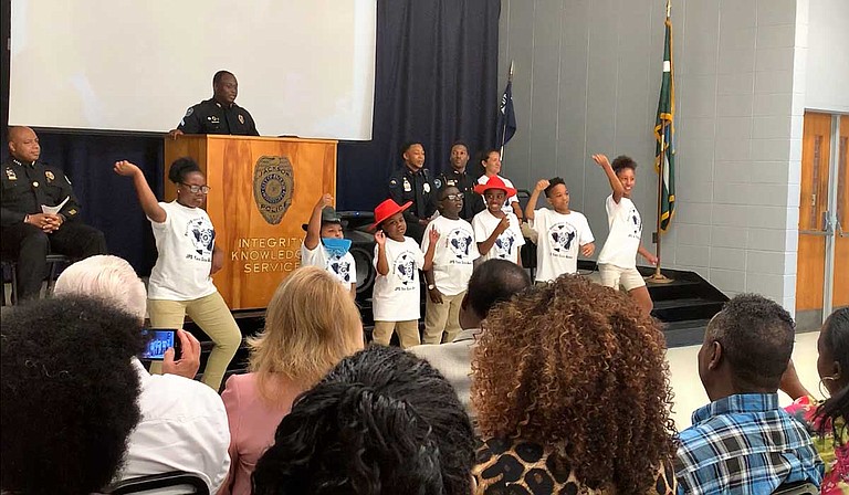 Youth from the Jackson Police Department Youth Citizens Police Academy dance to Lil Nas X's "Old Town Road", their class theme song, at their graduation ceremony on June 21. Photo by Shikira Porter