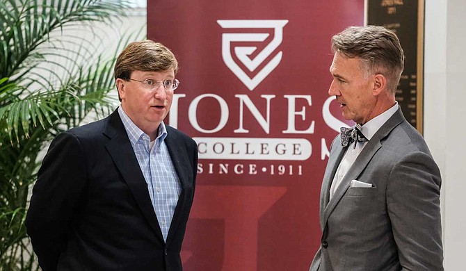 Mississippi Lt. Gov. Tate Reeves speaks with Jones College President Jesse Smith (right) at the school's campus moments after unveiling a $100 million plan to "modernize" Mississippi's workforce.