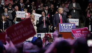 Donald Trump turned a campaign rally into an extended dissection of the liberal views of four Democratic congresswomen of color, deriding them for what he painted as extreme positions and suggesting they just get out. He is pictured here at a rally in Mississippi.