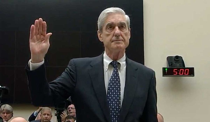 Robert Mueller on Wednesday bluntly dismissed President Donald Trump's claims of total exoneration in the federal probe of Russia's 2016 election interference, telling Congress he explicitly did not clear the president of obstructing his investigation. Photo courtesy CSPAN