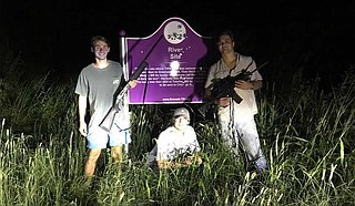 Three University of Mississippi students posed with rifles for a photo next to the bullet-riddled Emmett Till Marker in Tallahatchie County. They posted it on Instagram. Photo courtesy Instagram vis MCIR