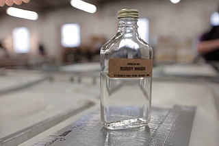 Tony Schnadelbach, a curator of interpretation at the Two Museums, said legal microdistilleries are currently operating in several Mississippi cities, including Canton, Oxford and Natchez. The Cathead Distillery in Jackson is fully operational and sells its gin, vodka and bourbon at liquor stores and bars across the state. Photo by Imani Khayyam