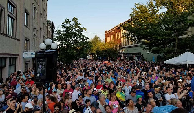 Hundreds of people, mostly young adults, stood shoulder-to shoulder Sunday night at a vigil and vented their frustration at the Republican governor, interrupting him with chants of "Make a change!" and "Do something!" as he talked about the victims. Photo courtesy Dayton, Ohio Facebook
