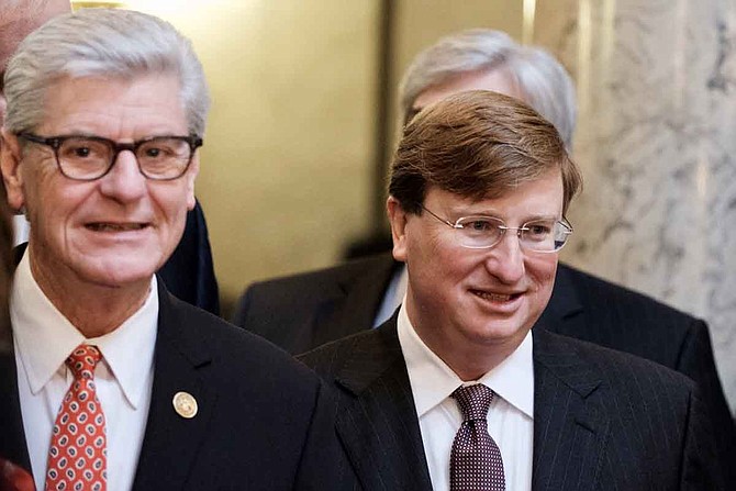 Mississippi Gov. Phil Bryant (left), a Republican, and Lt. Gov. Tate Reeves (right), the frontrunner to become the GOP nominee for governor later this month, have both tweeted full support for ICE and U.S. Attorney Mike Hurst for their workplace immigrant raids across Mississippi on Aug. 7. File photo.