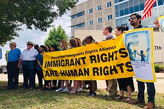 A group of immigrants’ rights activists protested against the Trump administration’s decision to open detention facilities in Mississippi outside the U.S. District Court building in Jackson last month. Photo by Ashton Pittman