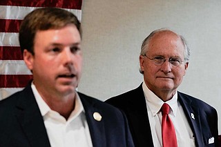 At a campaign stop at the Hattiesburg Clinic in Hattiesburg, Miss., on Aug. 13, former Mississippi Supreme Court Chief Justice Bill Waller (right) listens as former primary opponent Robert Foster (left) explains why he's decided to endorse him in the GOP runoff for Mississippi governor. Photo by Ashton Pittman