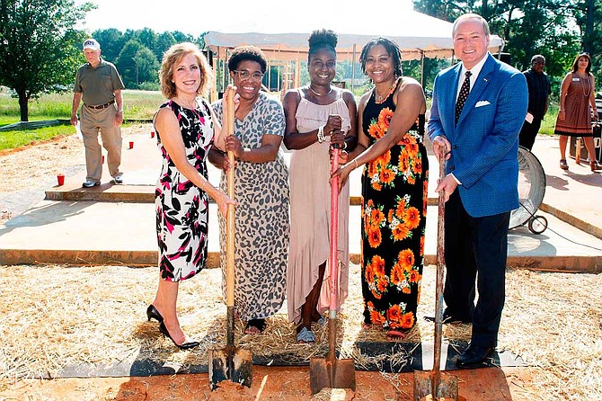 Mississippi State and Starkville Area Habitat for Humanity break ground on the 11th Maroon Edition home, which is being built for Keyana Triplett, center. Pictured, from left, are Starkville Area Habitat for Humanity Board of Directors President Nancy Lifer, Keyana’s sister Nikkol Triplett, Keyana Triplett, Keyana’s sister Linda Randle, and MSU President Mark E. Keenum. Photo courtesy Megan Bean/MSU