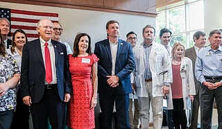 Former Mississippi Supreme Court Chief Justice Bill Waller (first left) stands next to his wife, Charlotte Waller (second left), and former opponent-turned endorsee Robert Foster (third left), at an event with medical professionals and administrators at the Hattiesburg clinic in Hattiesburg, Miss., on Aug. 13, 2019. Waller was there to tout his "Medicaid reform" plan and to accept Foster's endorsement. Photo by Ashton Pittman