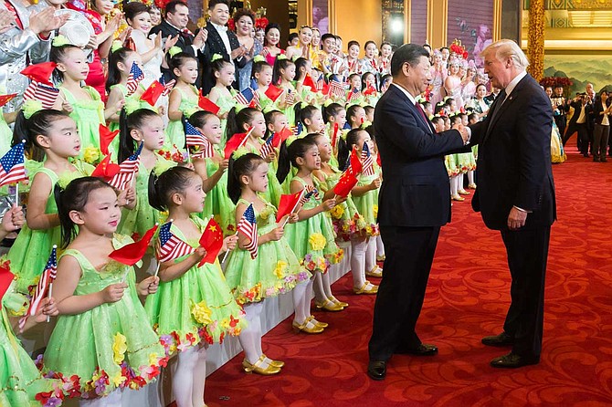 President Donald J. Trump and First Lady Melania Trump, joined by President Xi Jinping and First Lady Peng Liyuan, applaud and thank the performers at a cultural performance at the Great Hall of the People, Thursday, November 9, 2017, following a State Dinner in their honor, in Beijing, People’s Republic of China. Official White House Photo by Andrea Hanks