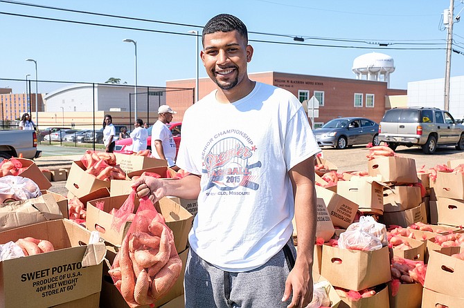 The Crop Drop, an annual event hosted by Jackson State University and the Society of St. Andrew, donated 25,000 pounds of sweet potatoes and other goods to the community on Saturday. Grant Broadway, a senior and Mister JSU 2019, poses for a photo at the event. Photo by Charles A. Smith/JSU