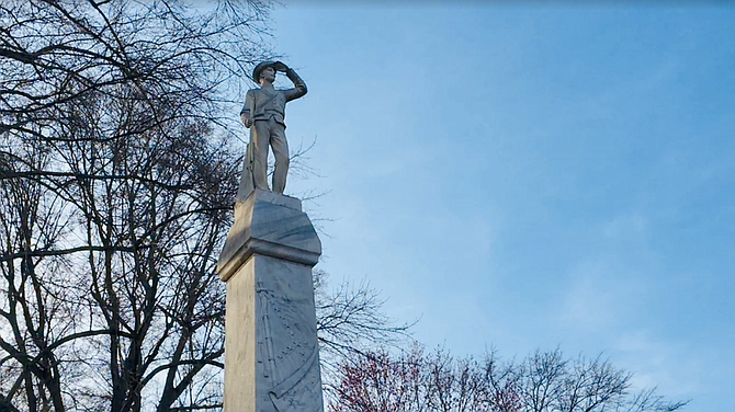 Sparks agreed in March to calls from faculty, students and staff to move the marble soldier and base from near the school's historic heart. The monument has stood sentry there since 1906, when the United Daughters of the Confederacy commissioned it. Photo by Brian Powers