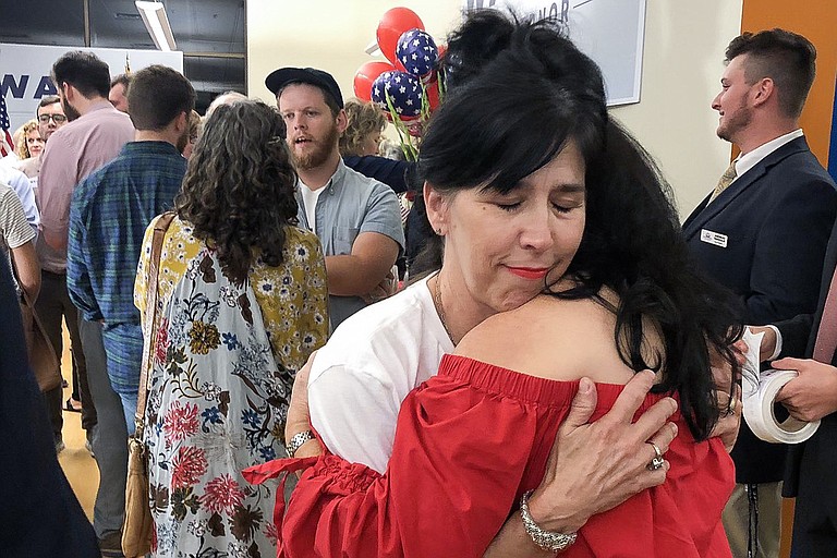 Tammy Pearson comforted friend Kay Holmes in downtown Jackson after their candidate, Bill Waller Jr., lost the GOP runoff for governor. Photo by Seyma Bayram