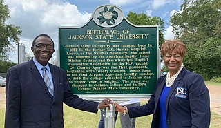 Alumnus and JSU professor Dr. Hilliard Lackey (left) poses beside the JSU historical marker in Natchez with JSUNAA President, Dr. Earlexia Norwood (right). Photo courtesy JSU