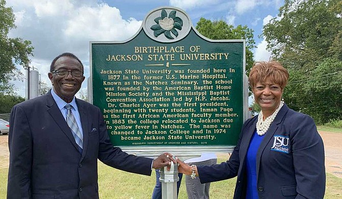 Alumnus and JSU professor Dr. Hilliard Lackey (left) poses beside the JSU historical marker in Natchez with JSUNAA President, Dr. Earlexia Norwood (right). Photo courtesy JSU