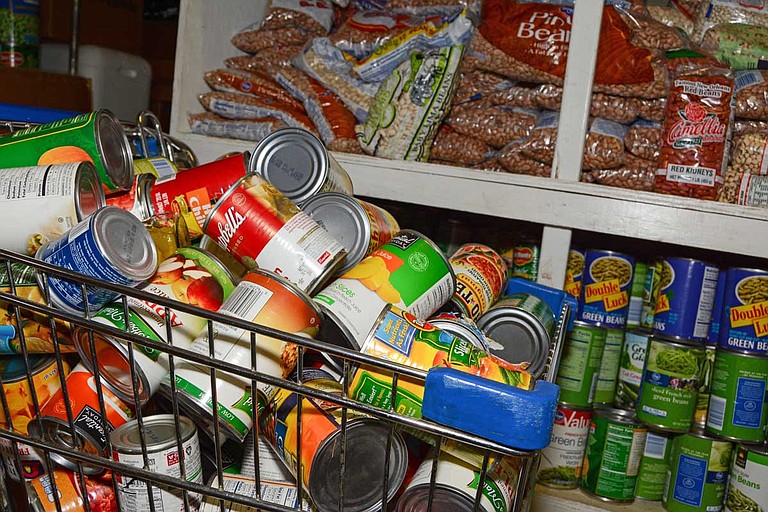 The Stewpot food pantry serves more than 5,000 people per year, half of which are senior citizens age 65 or over, Buckley says. Stewpot also provides guests with travel bags of items that don't need heating, including canned food, dried fruit and other items. File Photo by Trip Burns