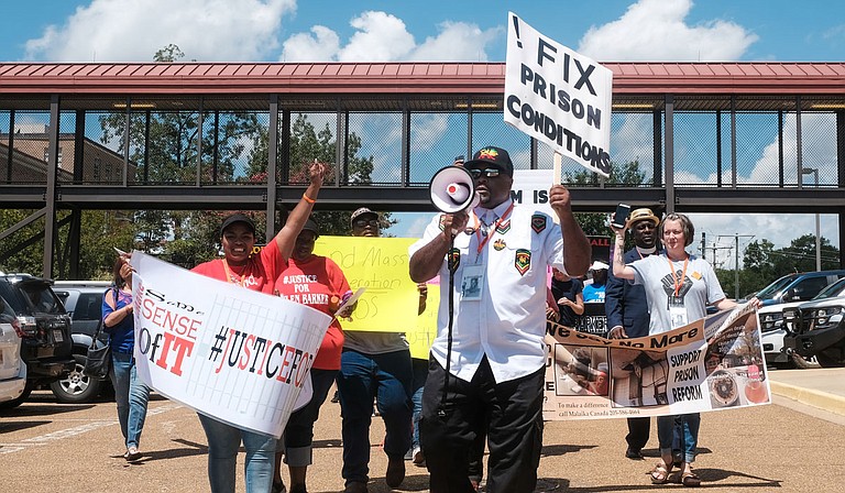 At a mass incarceration rally in Brandon, Miss., on July 29, family, friends and community members marched to end practices that they say incarcerate far too many people for far too long, often for nonviolent crimes.  Photo by Ashton Pittman.
