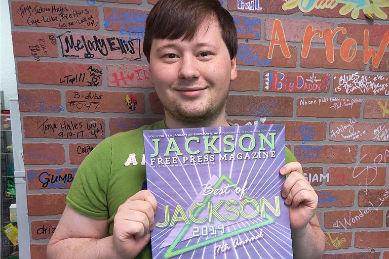 Deputy Editor Nate Schumann holds a copy of last year’s Best of Jackson issue, which was the first issue he helped put together when he first first joined the JFP as an assistant editor under then-managing editor Amber Helsel. Photo by Nick Judin
