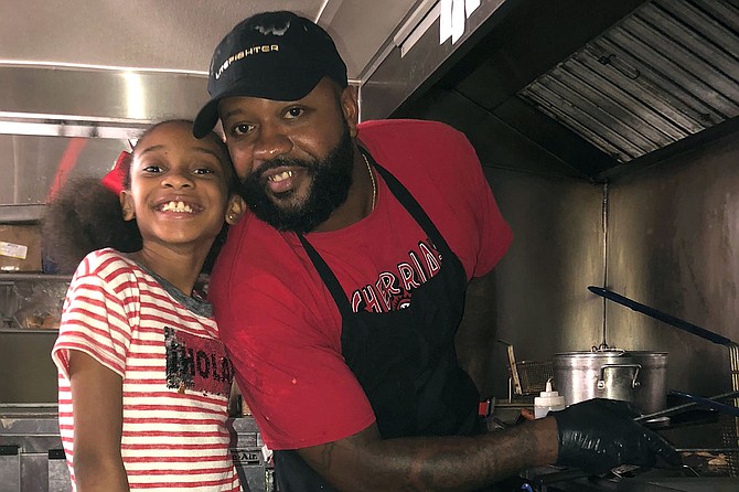 Chef Willie Williams Jr., teaches his daughter Willow the ropes of cooking. Photo courtesy Willie Williams