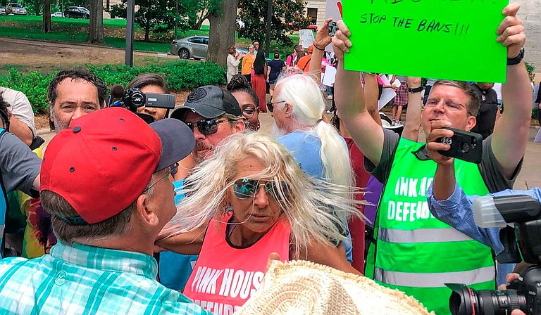 An abortion-rights rally outside the Mississippi Capitol building last year drew a moment of chaos when an anti-abortion activist with a bullhorn interrupted a speech. Photo by Ashton Pittman