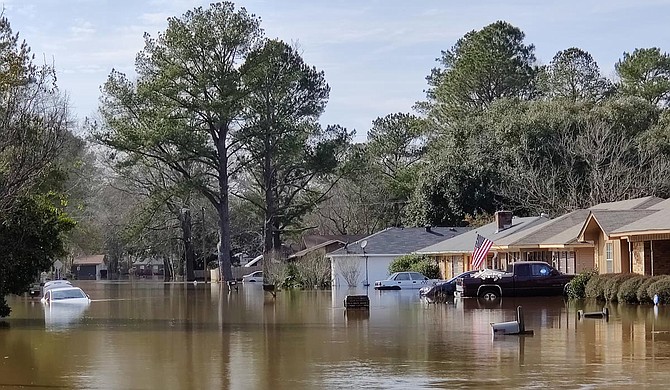 Miles from historic flooding along the Pearl River, west Jackson residents gathered for an update on last month’s flash floods. Public officials provided a bevy of potential solutions—and pitched the “One Lake” plan while they were there. Photo by Nick Judin