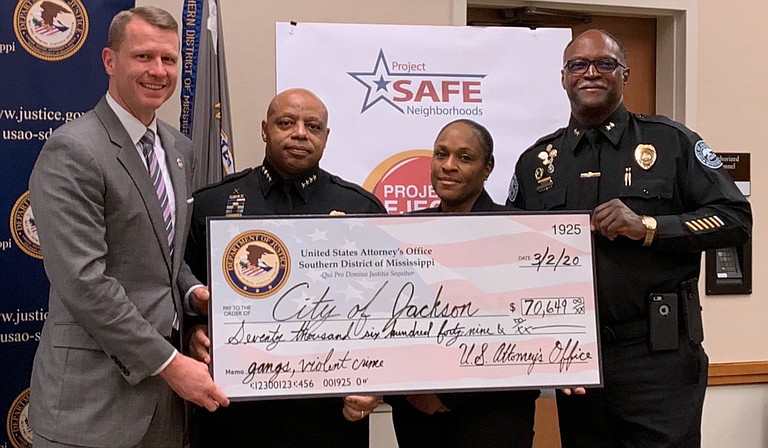 On March 2, 2020, U.S. Attorney for the Southern District of Mississippi Mike Hurst tweeted this photo showing Jackson Police Chief James E. Davis accepting a $70,649 grant check on behalf of the City of Jackson. Hurst’s tweet stated that the City had received the grant under ProjectEJECT “to combat gangs & violent crime in our Capital City.” Photo courtesy Mike Hurst Twitter