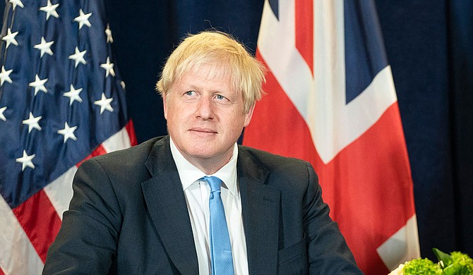 British Prime Minister Boris Johnson's office said he was tested after showing mild symptoms for the coronavirus and is self-isolating and continuing to lead Britain's response to the pandemic. Official White House Photo by Shealah Craighead