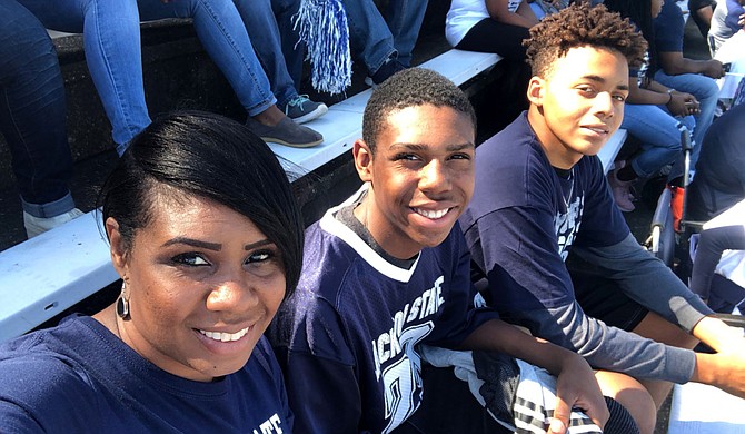 Jackson attorney Felisha Sheppard, pictured here with her sons Aaron Evans and Camry Watkins, shared her positive COVID-19 diagnosis in the hope that it could help put a face on the disease and support others who are navigating the pandemic. Photo courtesy Felisha Sheppard.