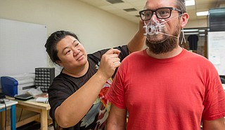 Anna Wan, mathematics professor at USM, used a 3-D printer to make 250 respirator masks for medical professionals in the Pine Belt who are treating COVID-19 patients. Photo courtesy USM