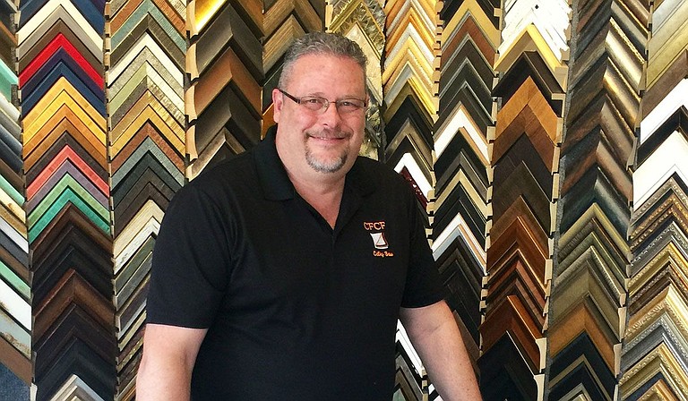 Calby Boss, owner of Calby's Fine Custom Framing in Flowood, offers specialized framing, art and photograph restoration, mirror repair and more. Photo courtesy Calby Boss