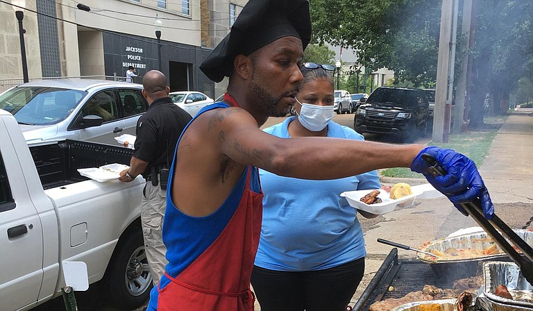 Chef Kazzy Ferdinand served at the Ward 3 Juneteenth celebration in downtown Jackson. Photo by Kayode Crown